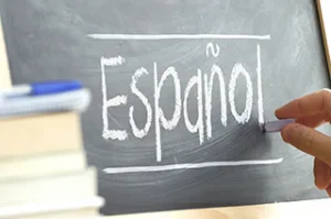 Spanish language instruction materials featuring introductory vocabulary and language learning concepts.